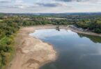 Aerial view of Ardingly Reservoir in Sussex showing low water levels during October 2025.