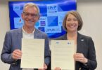 The Water Council Executive Director Karen Frost and Eric Servat sign a memorandum of action strengthening collaboration between water technology clusters in the U.S. and France.